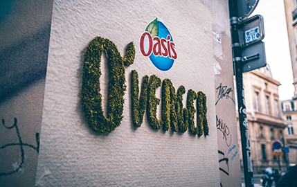 Oasis unveiled its new fruit-flavored drink with a green graffiti