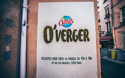 Oasis unveiled its new fruit-flavored drink with a green graffiti