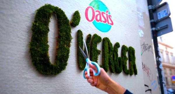 Oasis unveiled its new fruit-flavored drink with a green graffiti